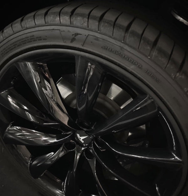Close up image of tyre with fitted Black Rimblades® Original alloy wheel rim protectors 
